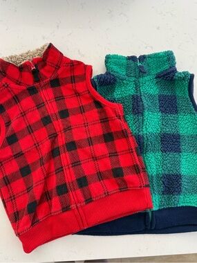 Pair of kids fleece vests